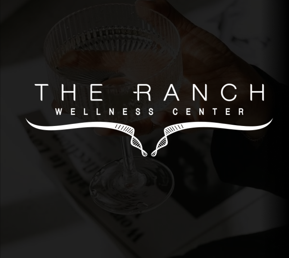 Logo of The Ranch Wellness Center with a blurred background